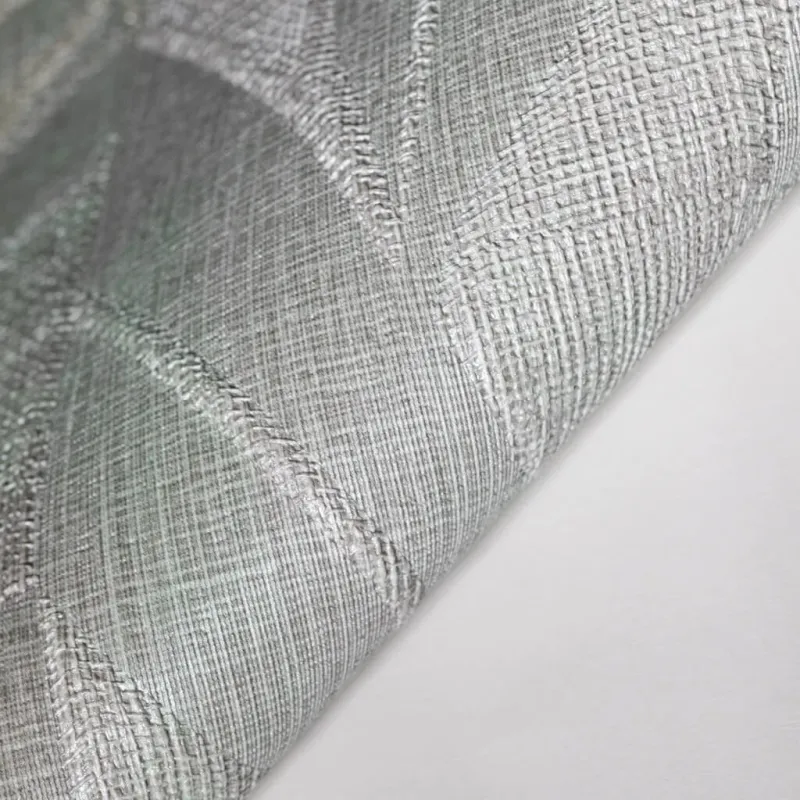 Modern non-woven wallpaper with linen texture and tropical leaf pattern in square blocks in beige/green tones