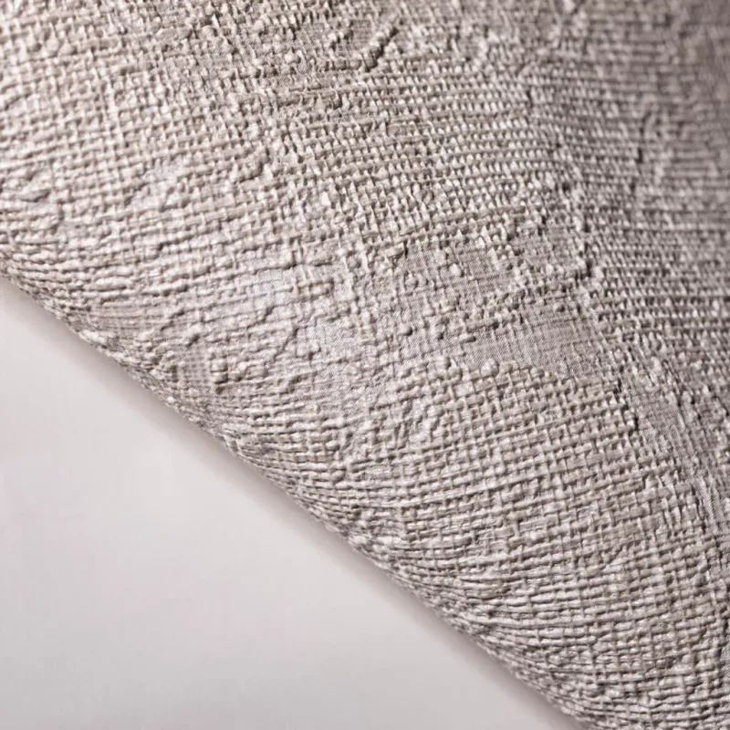 Modern non-woven wallpaper with linen texture in light brown and beige tones