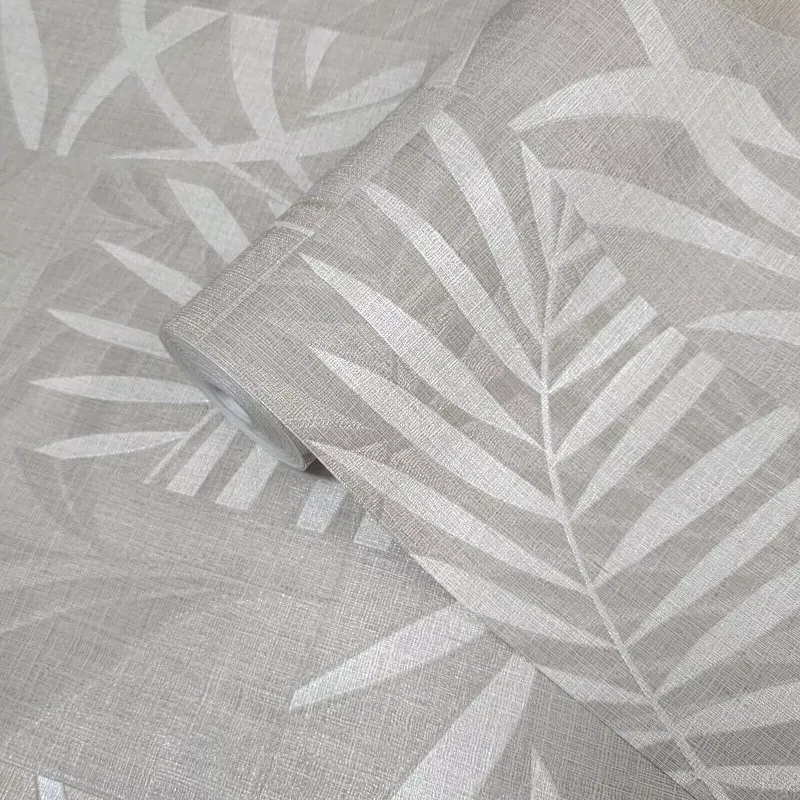 Modern non-woven wallpaper with linen texture and tropical leaf pattern in square blocks in light beige/cream tones