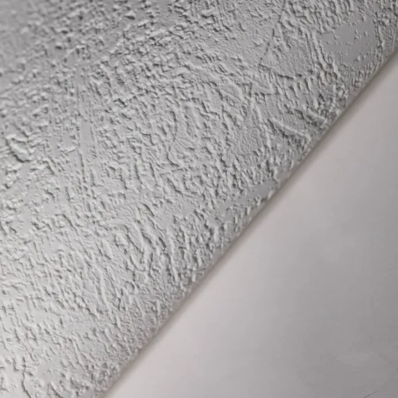 Modern non-woven wallpaper with subtle texture and abstract distressed look in light beige/off-white tones