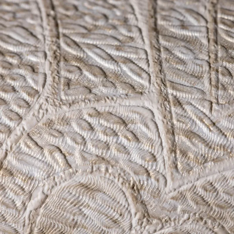 Luxurious non-woven wallpaper with embossed damask pattern in light cream/beige tones