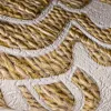 Luxurious non-woven wallpaper with embossed gold damask pattern in cream/beige tones