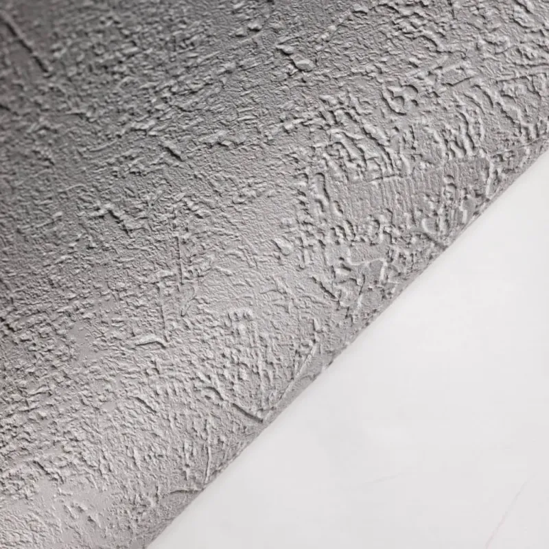 Papier peint en fibre intissée moderne à texture légère et aspect béton vieilli abstrait dans des tons gris/beige